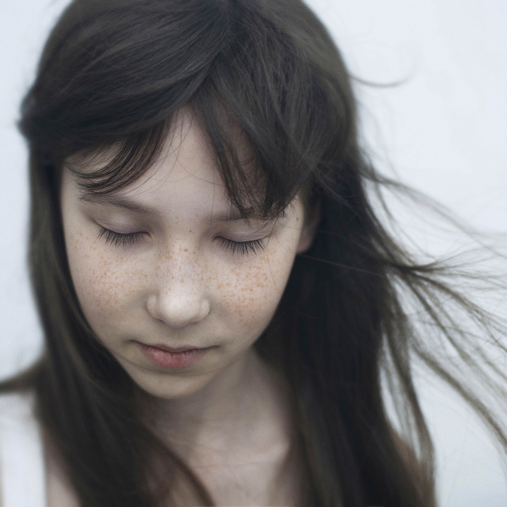 Wind blowing hair of Caucasian girl