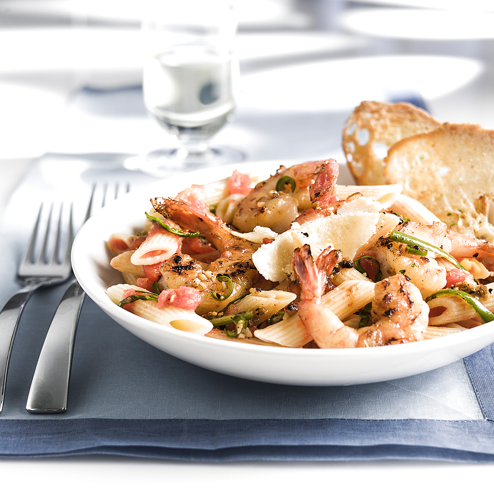 Plate of shrimp and pasta with bread