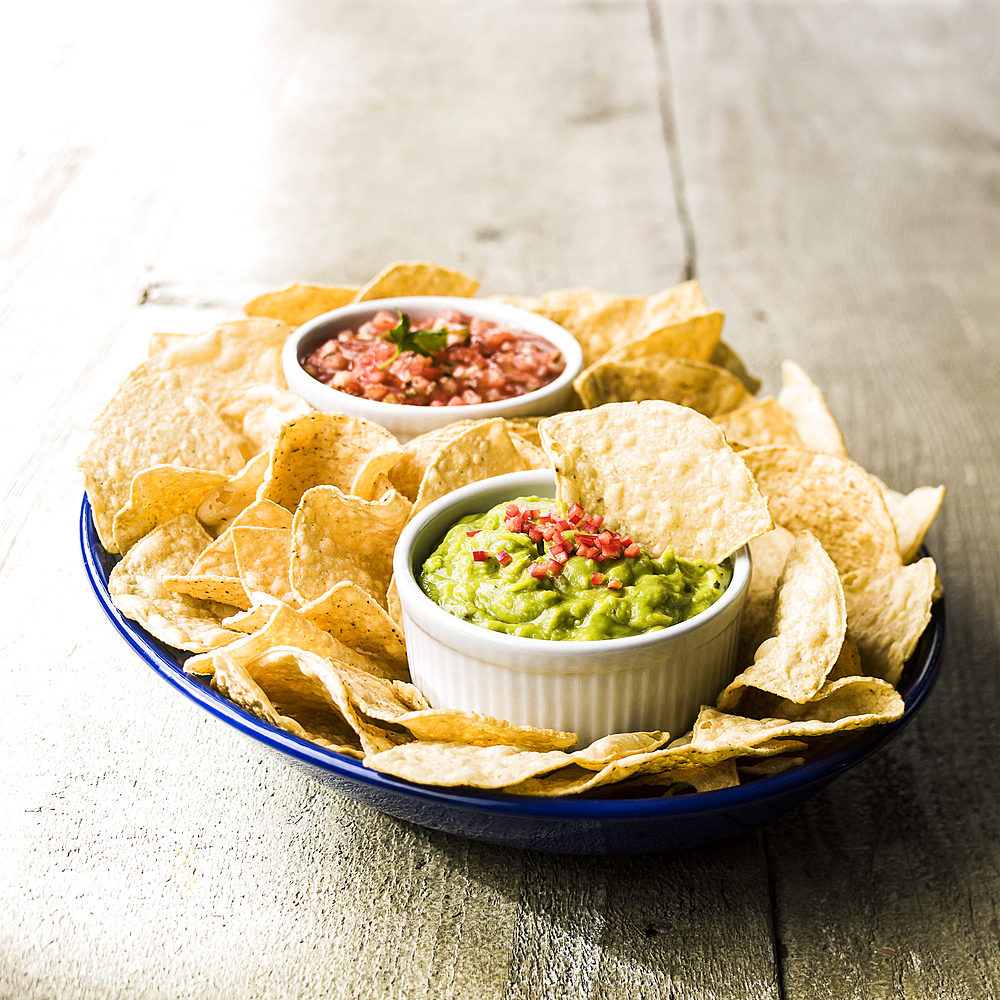 Bowl of chips with salsa and guacamole