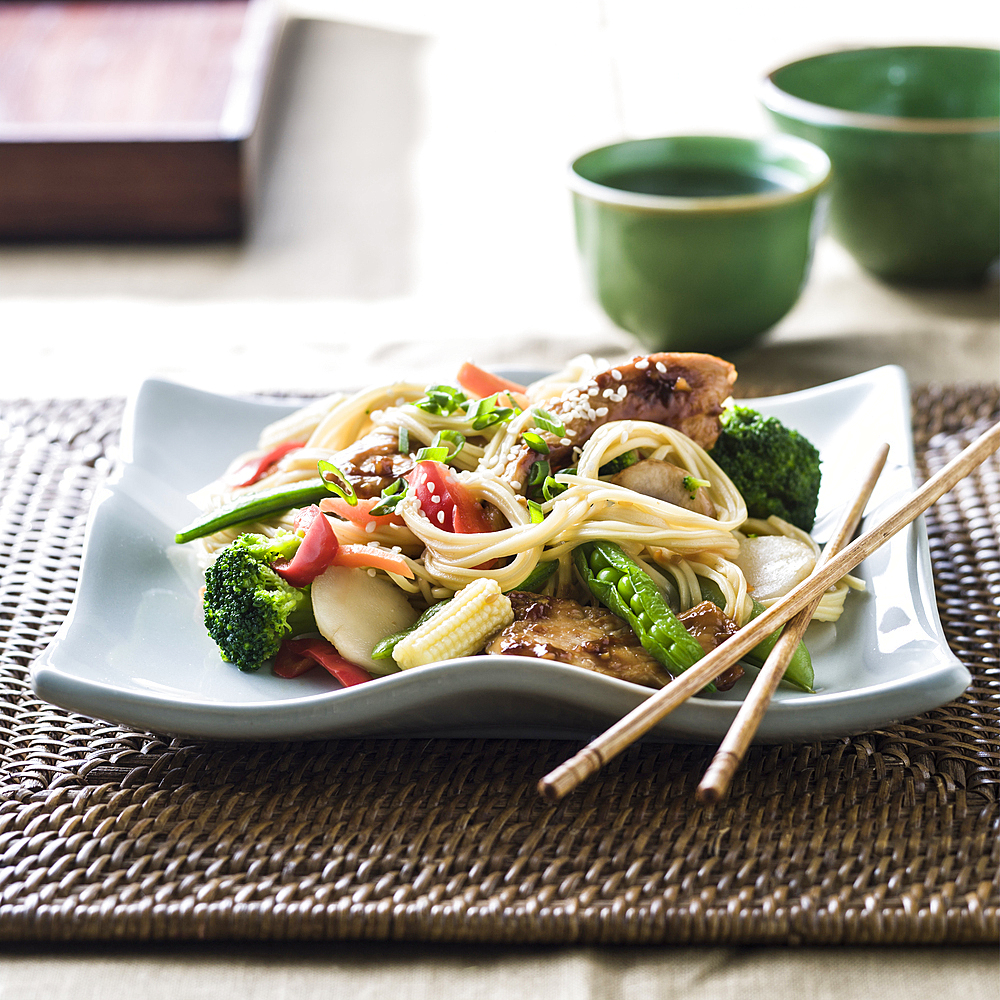 Stir fry on plate with chopsticks