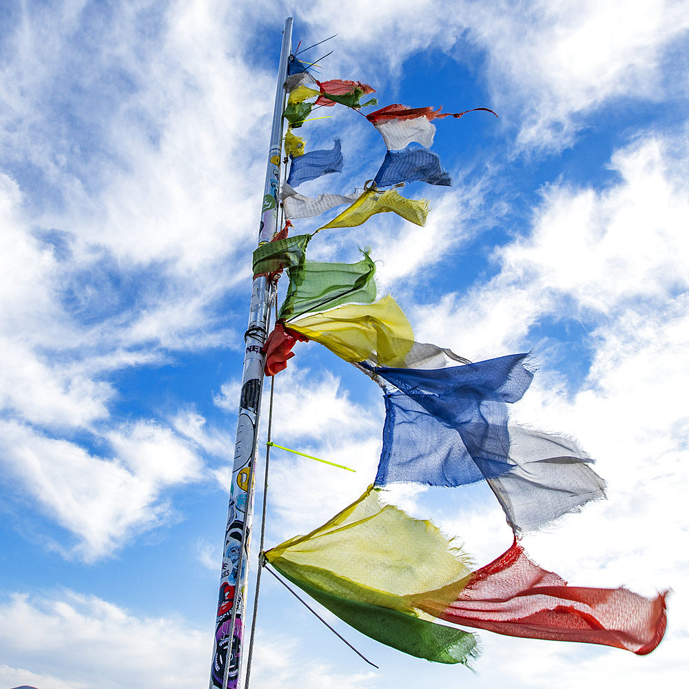 Prayer flags fluttering in wind atop Carbonate Mountain