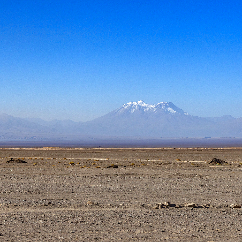 Distant volcano cone in Atacama Desert