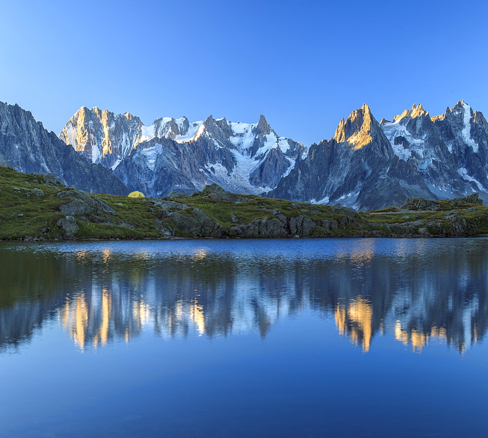 Grandes Jorasses and Dent du Geant reflected at sunrise in Lac des Cheserys, Haute Savoie, French Alps, France, Europe 