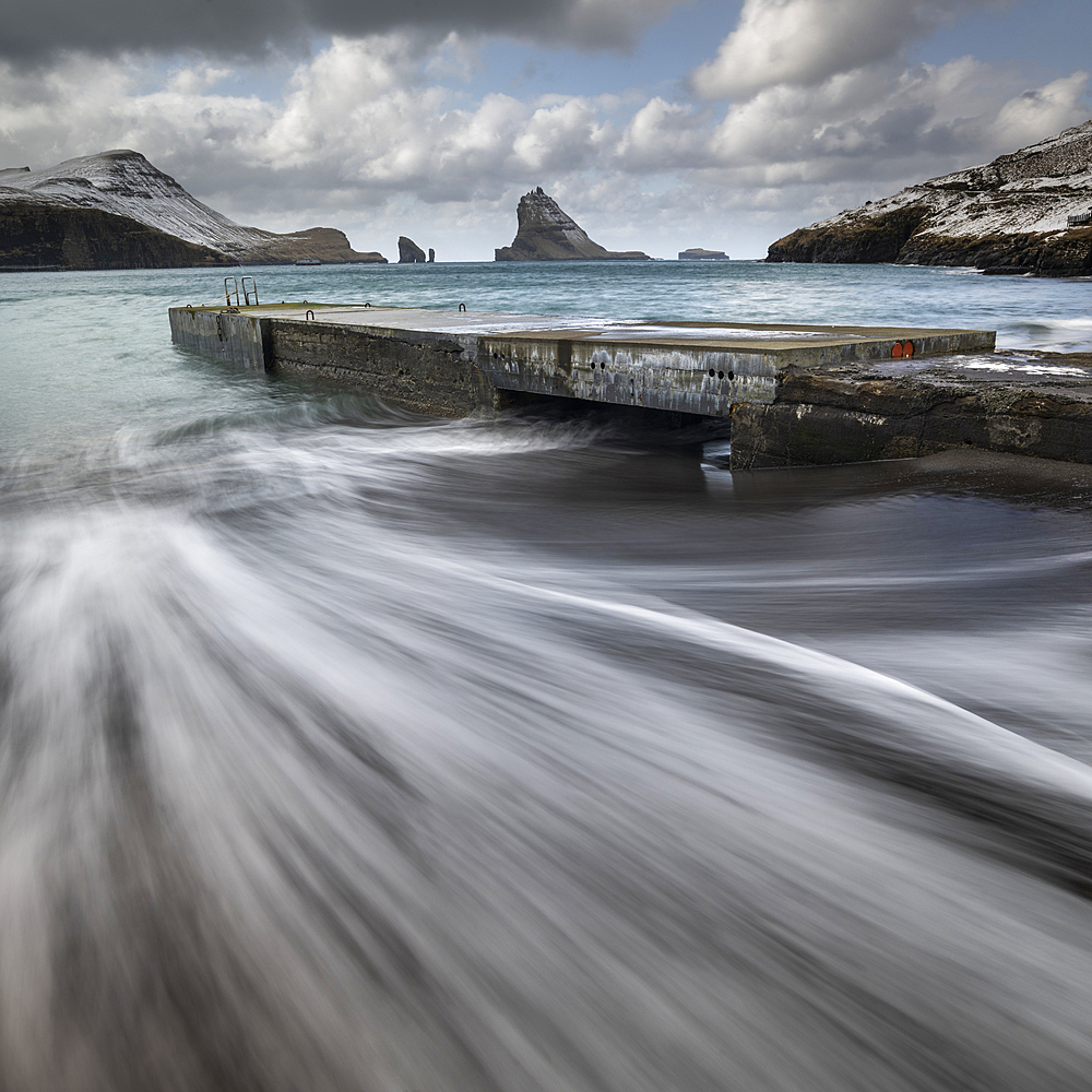 Pier and sea stacks from the shores of Bour, Vagar Island, Faroe Islands, Denmark, Europe