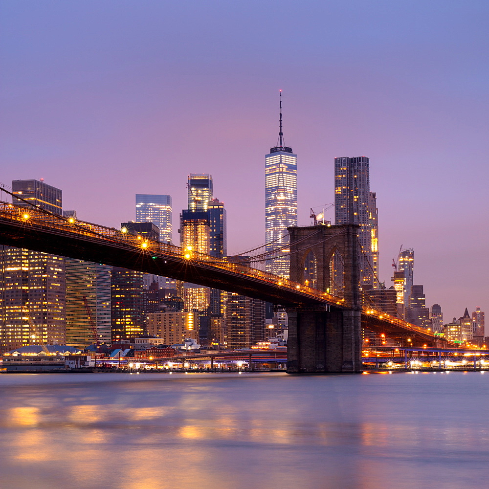 Brooklyn Bridge and Lower Manhattan skyline at dawn, New York City, New York, United States of America, North America