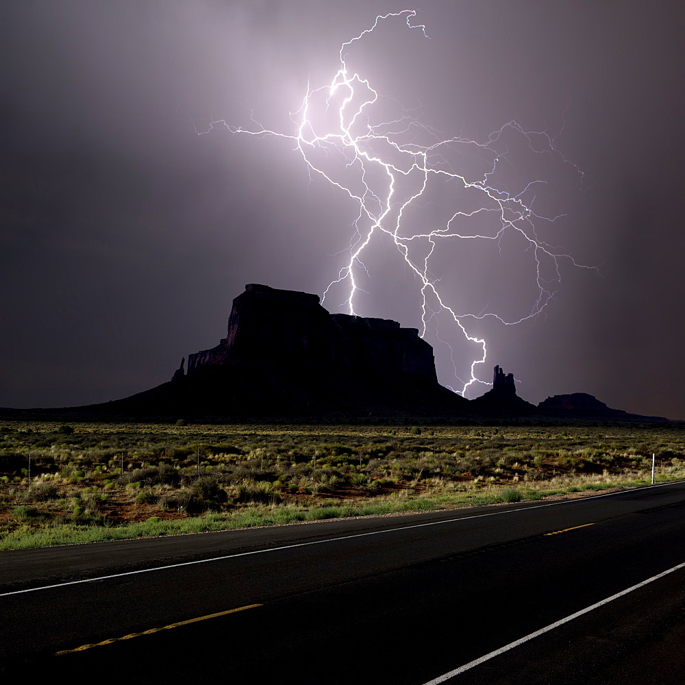 Composite photo of lightning striking behind Eagle Mesa off Highway 163 in 2016, near Monument Valley, Utah, United States of America, North America