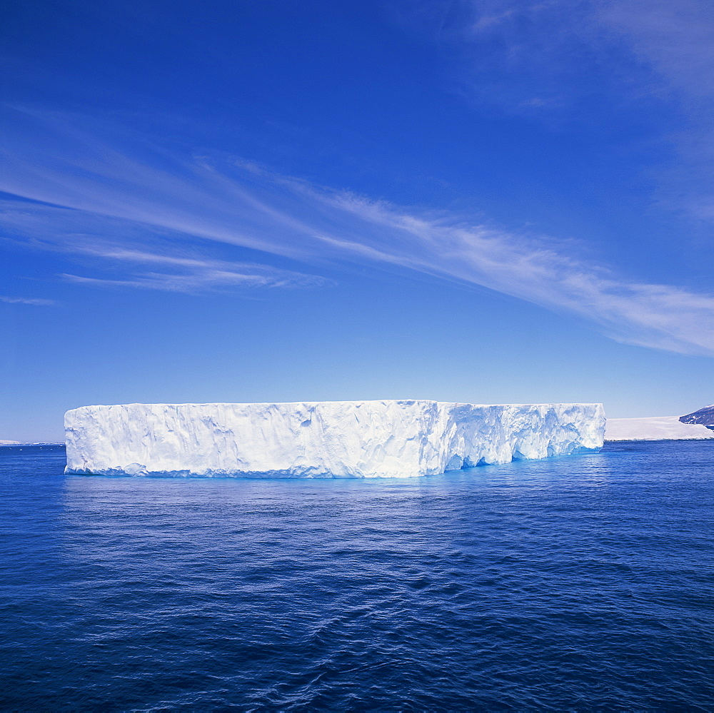 Tabular iceberg in blue sea in Antarctica, Polar Regions