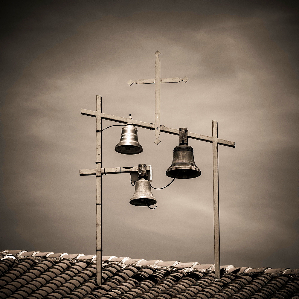 Bells and Crosses on the roof of a church, Haute-Loire department, Auvergne, France, Europe