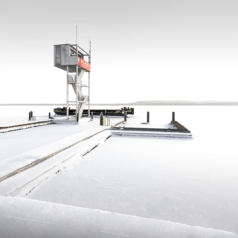 Snowed-in rescue tower in frozen Mueggelsee, Berlin, Germany, Europe