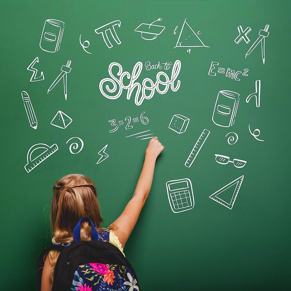 medium shot girl writing green board. High resolution photo