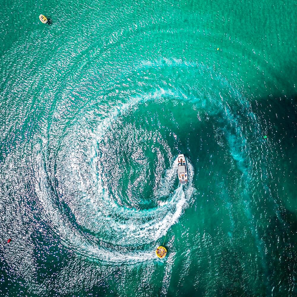 Aerial view on motorboat and jetski on the sea surface