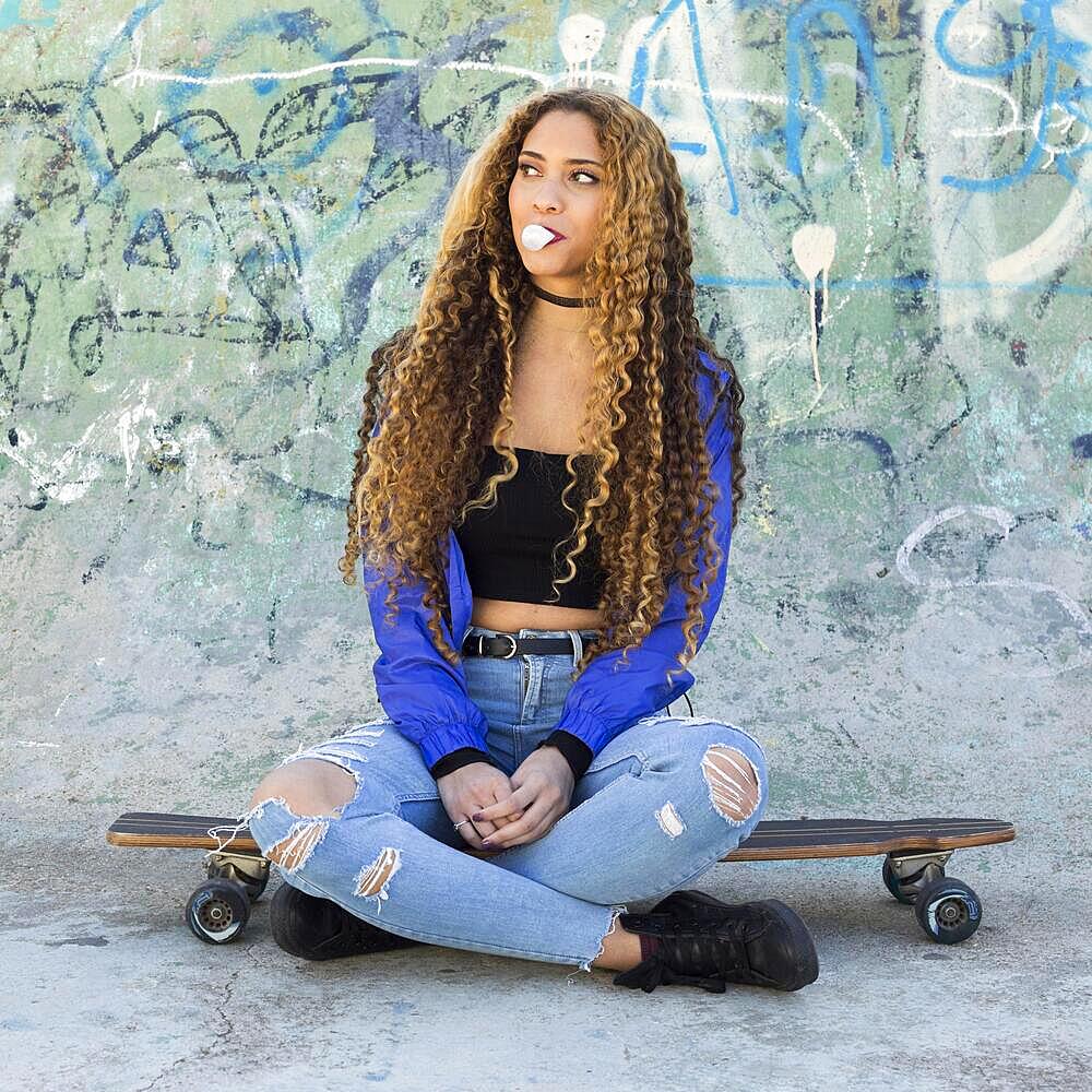 Young urban skater woman