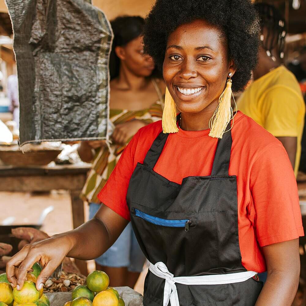 Smiley african woman working market