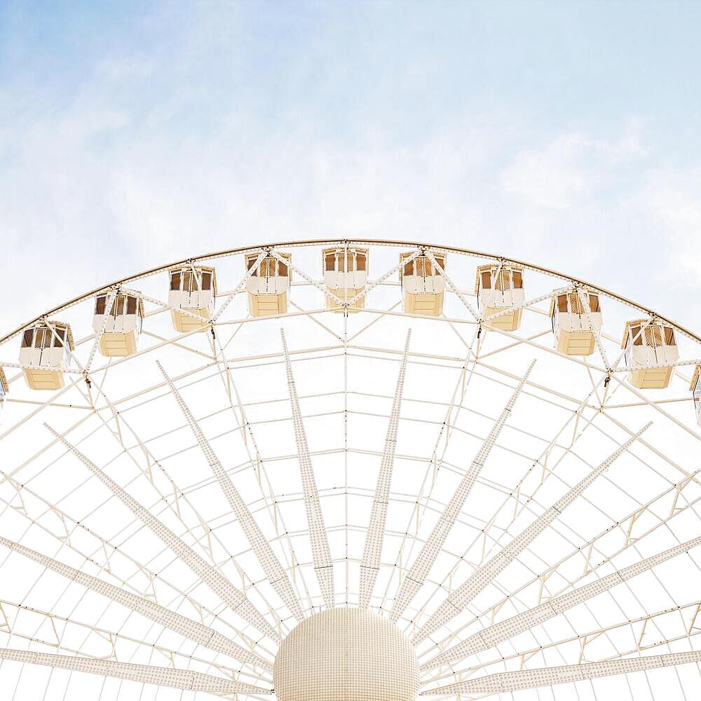 Close up white big giant wheel against blue sky