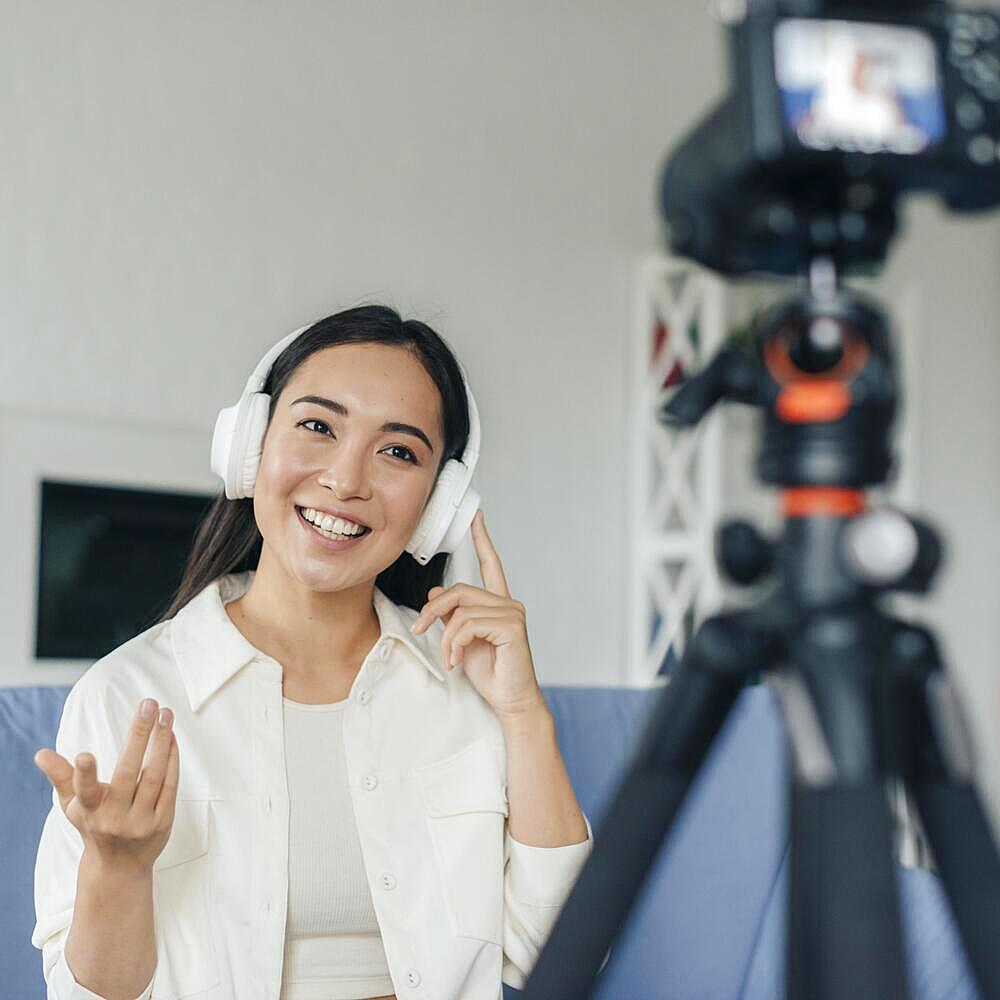 Young woman live streaming from home