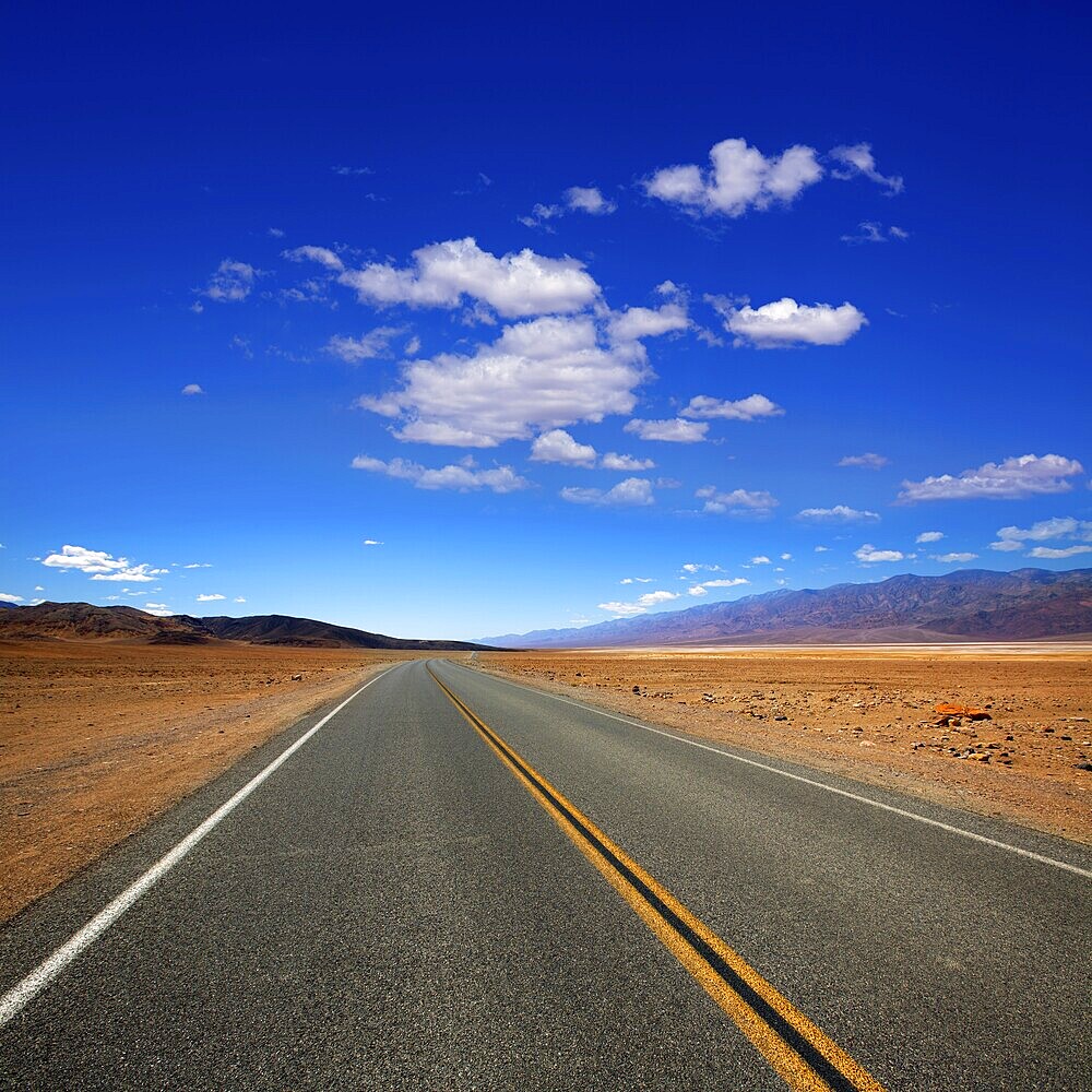 Deserted Route 190 highway in heart of Death Valley California