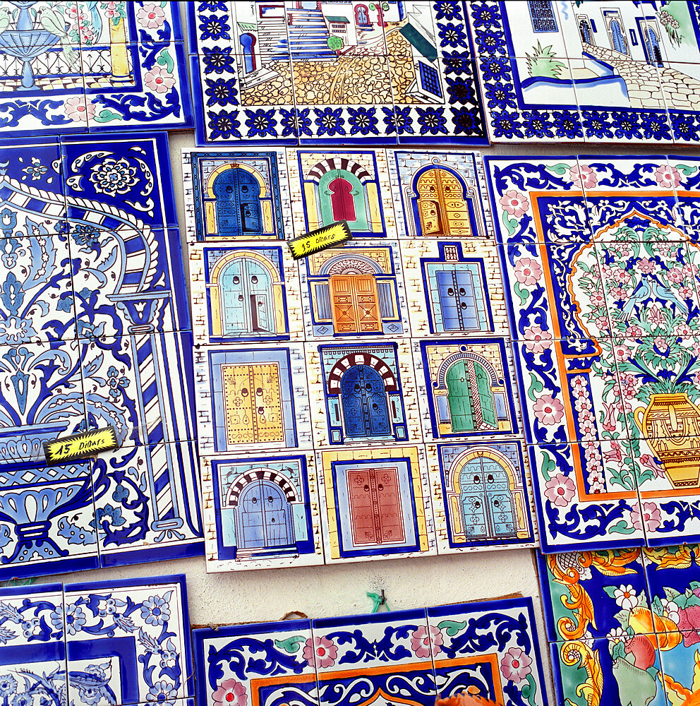 Tiles decorated with Tunisian doorways on souvenir stall, Hammamet, Cap Bon, Tunisia, North Africa, Africa