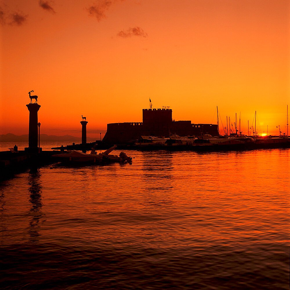 Mandraki Harbour at sunrise, Rhodes Town, Rhodes Island, Dodecanese Islands, Greek Islands, Greece, Europe