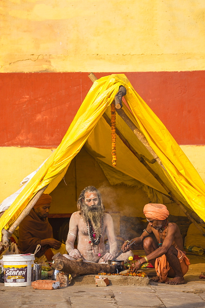 Hindu holy men sitting outside tent, Southern Ghats, Varanasi, Uttar Pradesh, India, Asia