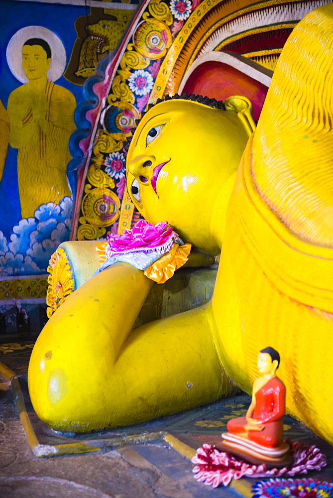 Golden reclining Buddha at Temple of the Tooth (Temple of the Sacred Tooth Relic) in Kandy, UNESCO World Heritage Site, Sri Lanka, Asia