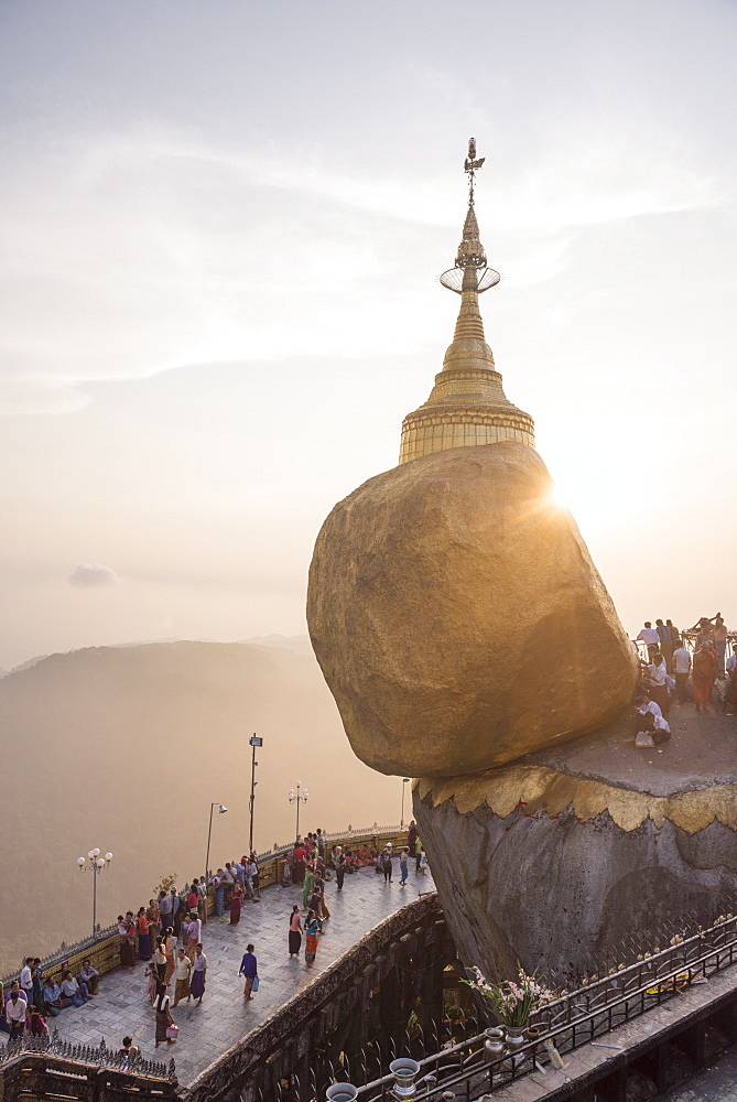 Pilgrims at Golden Rock Stupa (Kyaiktiyo Pagoda) at sunset, Mon State, Myanmar (Burma), Asia