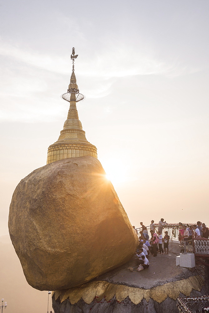 Pilgrims at Golden Rock Stupa (Kyaiktiyo Pagoda) at sunset, Mon State, Myanmar (Burma), Asia