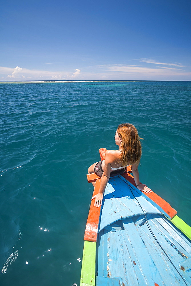 Woman on a traditional Indonesian boat trip to Marak Island near Padang in West Sumatra, Indonesia, Southeast Asia, Asia