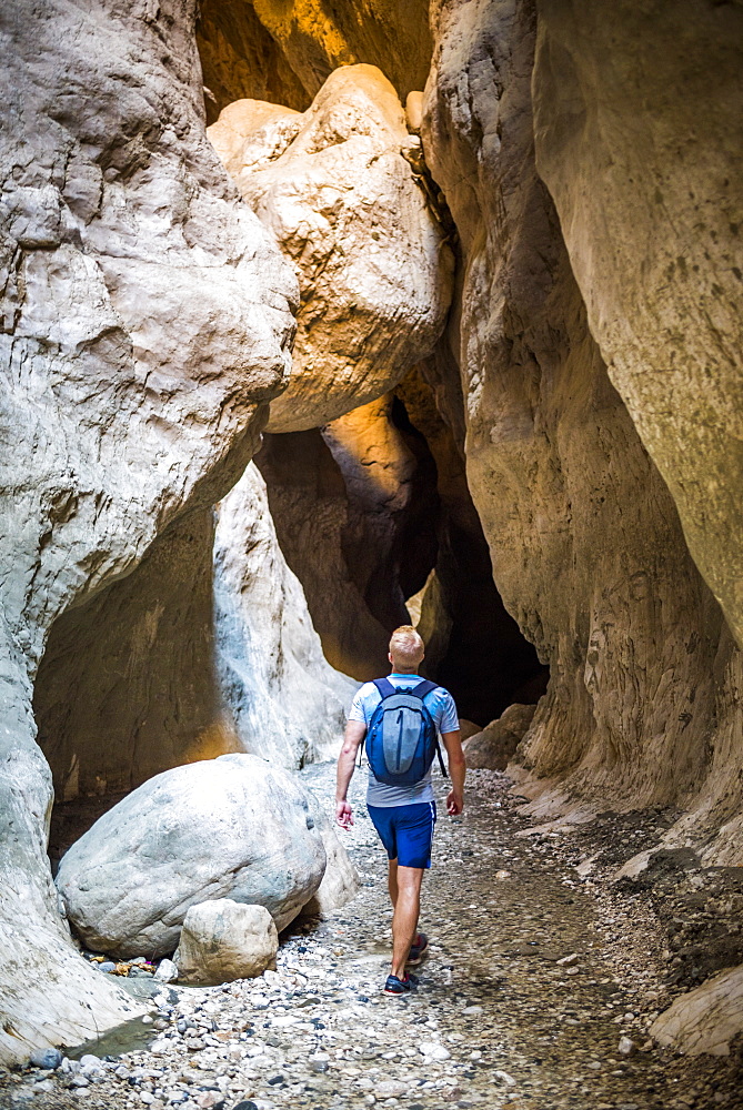 Tourist hiking in Saklikent Gorge, Saklikent National Park, Fethiye Province, Lycia, Anatolia, Turkey, Asia Minor, Eurasia