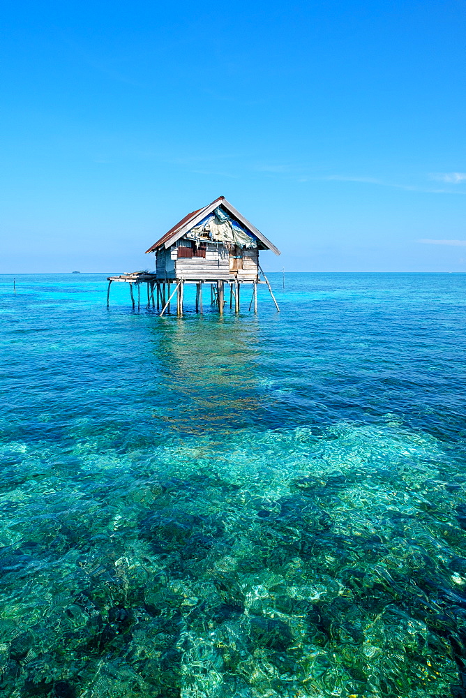 Huts built over the water by the Bajau Fishermen who live there three months of the year, Togian Islands, Indonesia, Southeast Asia, Asia