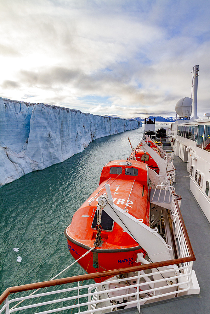 The Lindblad Expedition ship National Geographic Explorer near a glacier in the Svalbard Archipelago, Norway, Arctic, Europe