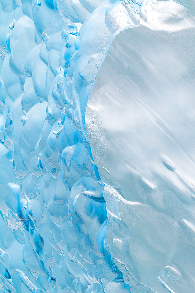 Glacial iceberg detail from ice calved off the Sawyer Glacier in Tracy Arm, Southeast Alaska, USA, Pacific Ocean.