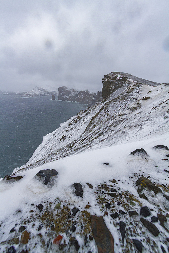 Snow covering the ash and mud slides at Deception Island, South Shetland Islands, Antarctica, Southern Ocean.