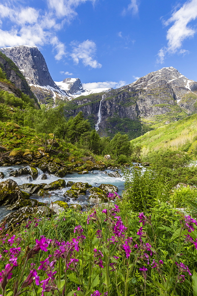 Slow shutter speed silky water of the Olden River as it flows along Briksdalen, Olden, Nordfjord, Norway, Scandinavia, Europe