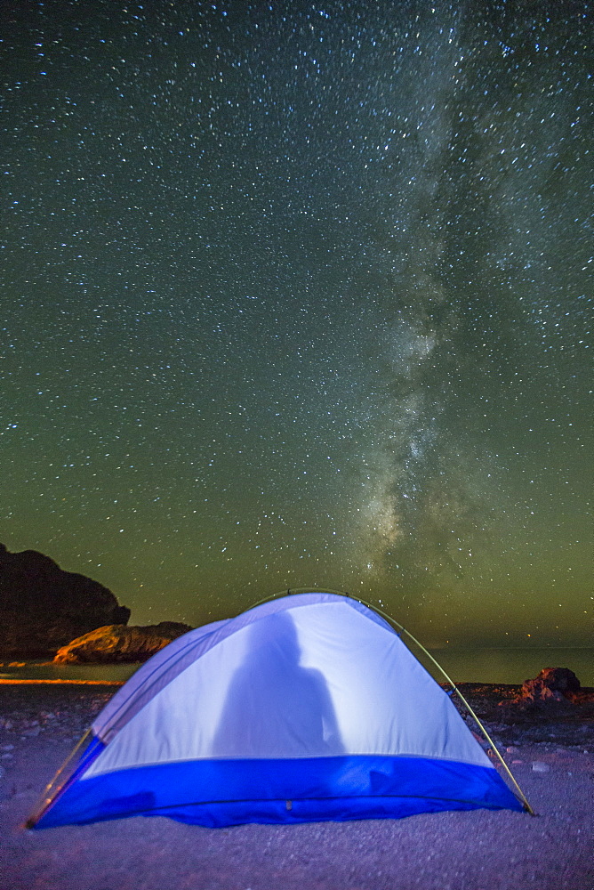 Night view of the Milky Way with lit up tent in foreground, Himalaya Beach, Sonora, Mexico, North America