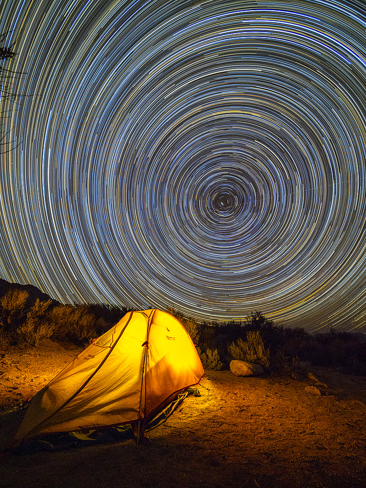 Night view of a pitched tent in the Alabama Hills National Scenic Area, California, USA.