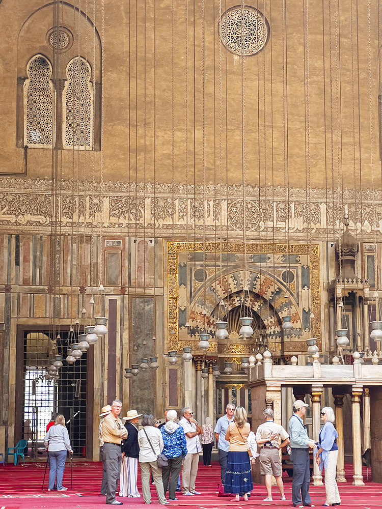 Tourists at the Mosque of Sultan Hassan, built between 1356 and 1363 during the Bahri Mamluk period, Cairo, Egypt, North Africa, Africa