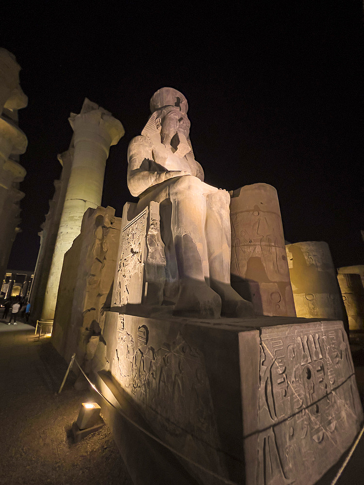 The Luxor Temple at night, a large Ancient Egyptian temple complex constructed approximately 1400 BCE, UNESCO World Heritage Site, Luxor, Thebes, Egypt, North Africa, Africa