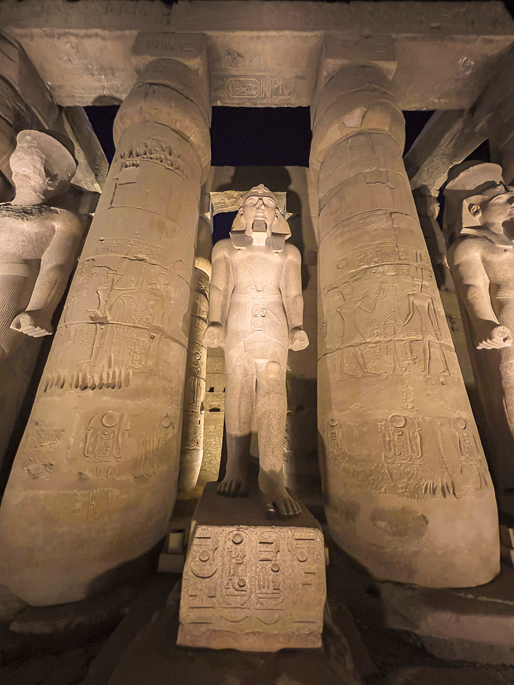 The Luxor Temple at night, a large Ancient Egyptian temple complex constructed approximately 1400 BCE, UNESCO World Heritage Site, Luxor, Thebes, Egypt, North Africa, Africa