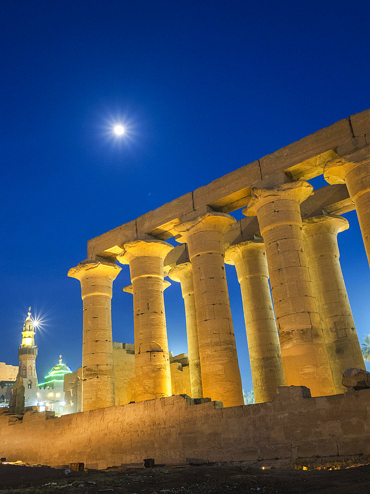 The Luxor Temple at night, under a full moon, constructed approximately 1400 BCE, UNESCO World Heritage Site, Luxor, Thebes, Egypt, North Africa, Africa