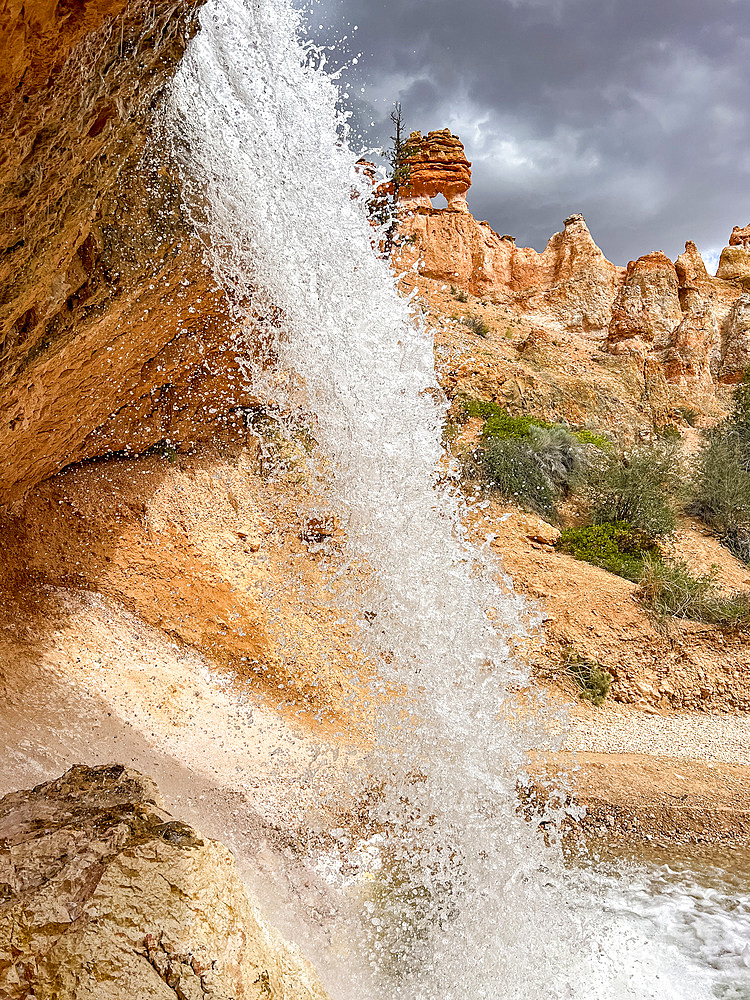 A waterfall running through the Mossy Cave Trail in Bryce Canyon National Park, Utah, United States of America, North America