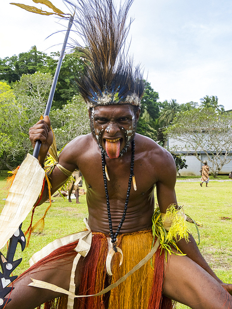 Six different groups of native warriors, drummers, and dancers perform on Kwato Island, Papua New Guinea, Pacific