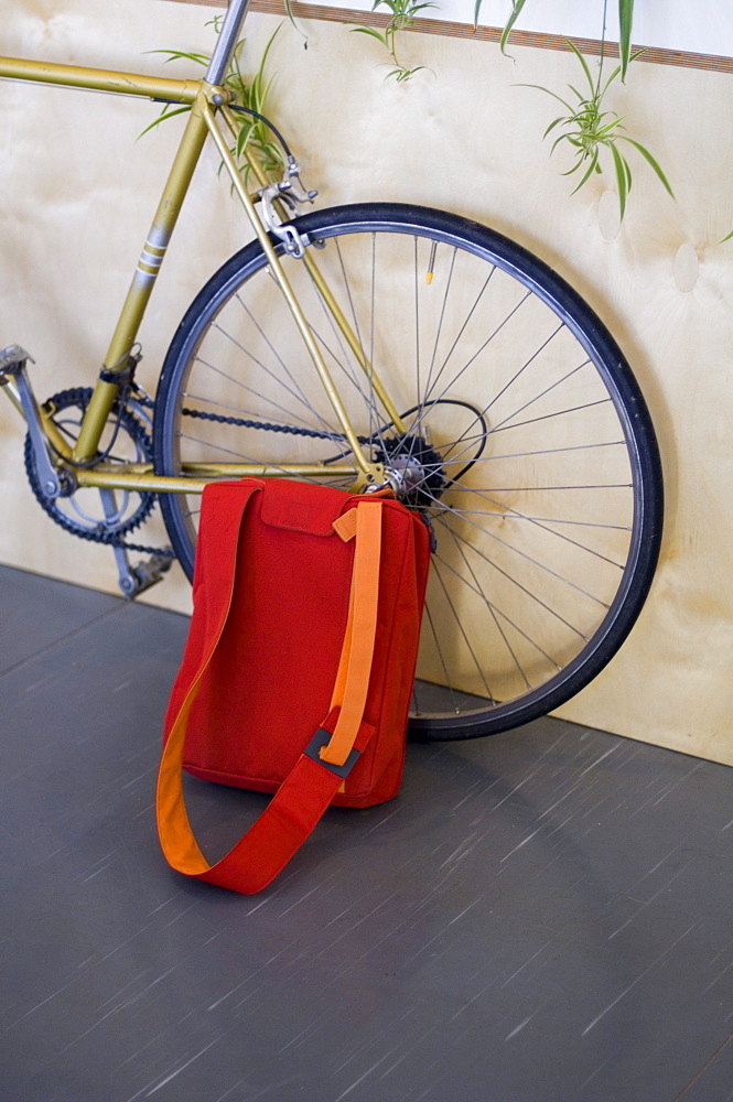 Bag leaning against bicycle