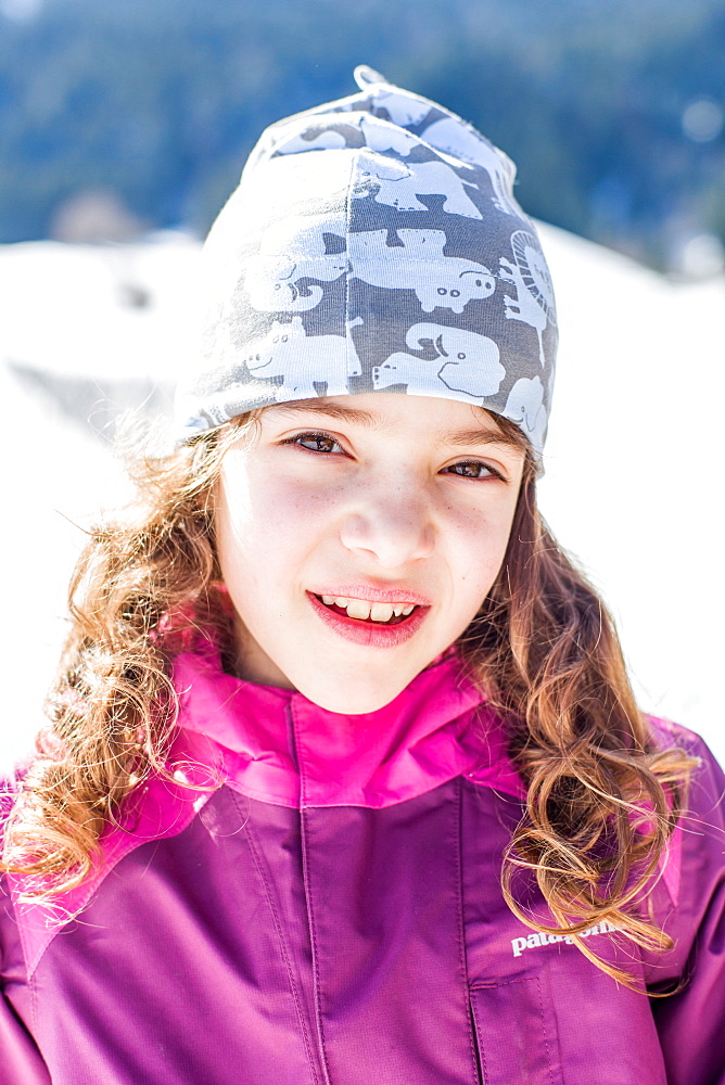 Portrait of a girl while sledging, Pfronten, Allgaeu, Bavaria, Germany