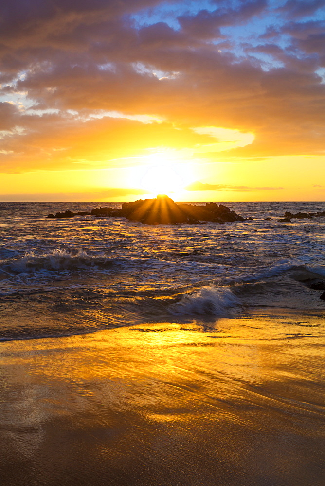 A golden sunset at Ulua Beach with wave, Wailea, Maui, Hawaii, United States of America