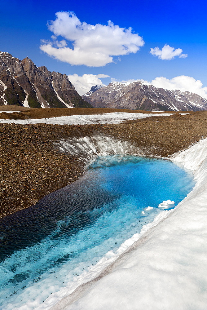 Glacial lake on Kennicott Glacier, with Wrangell Mountains in background, in summer, Wrangell–St. Elias National Park and Preserve, Alaska, United States of America