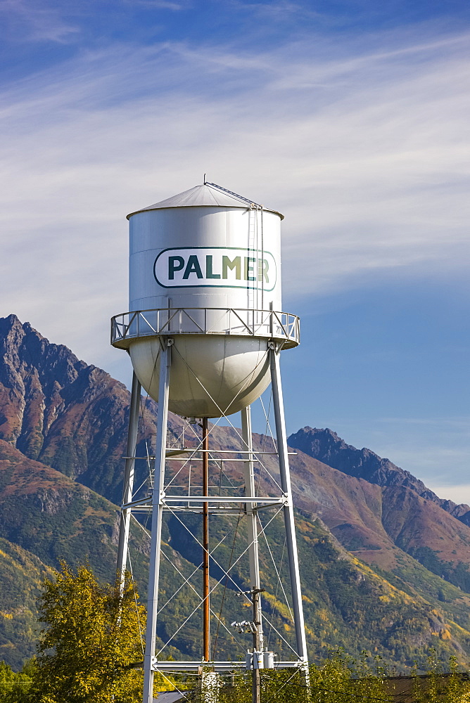 Downtown Palmer water tower, cloudy skies and the Chugach Mountains in the background, South-central Alaska,, Palmer, Alaska, United States of America