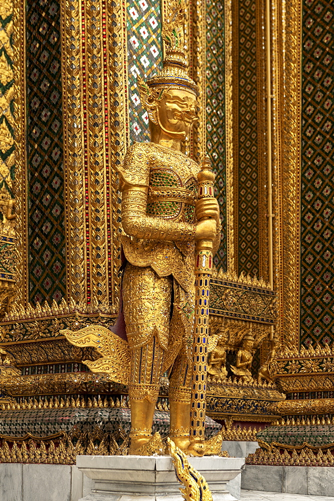 Temple of the Emerald Buddha golden guardian statue, Grand Palace, Bangkok, Thailand