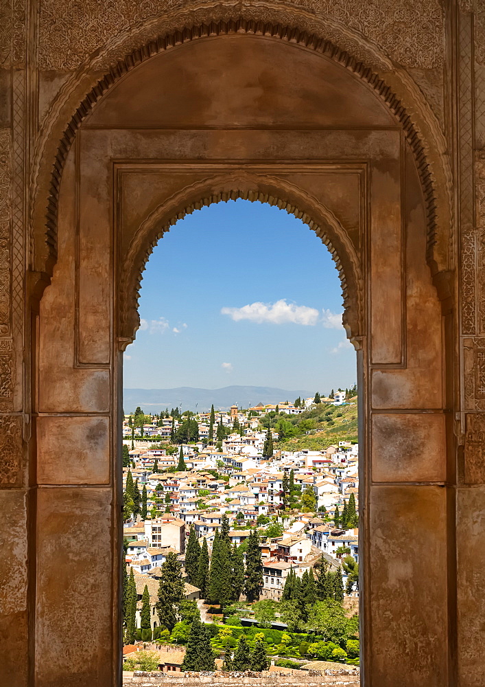 Arched window with a view from Alhambra; Granada, Andalusia, Spain