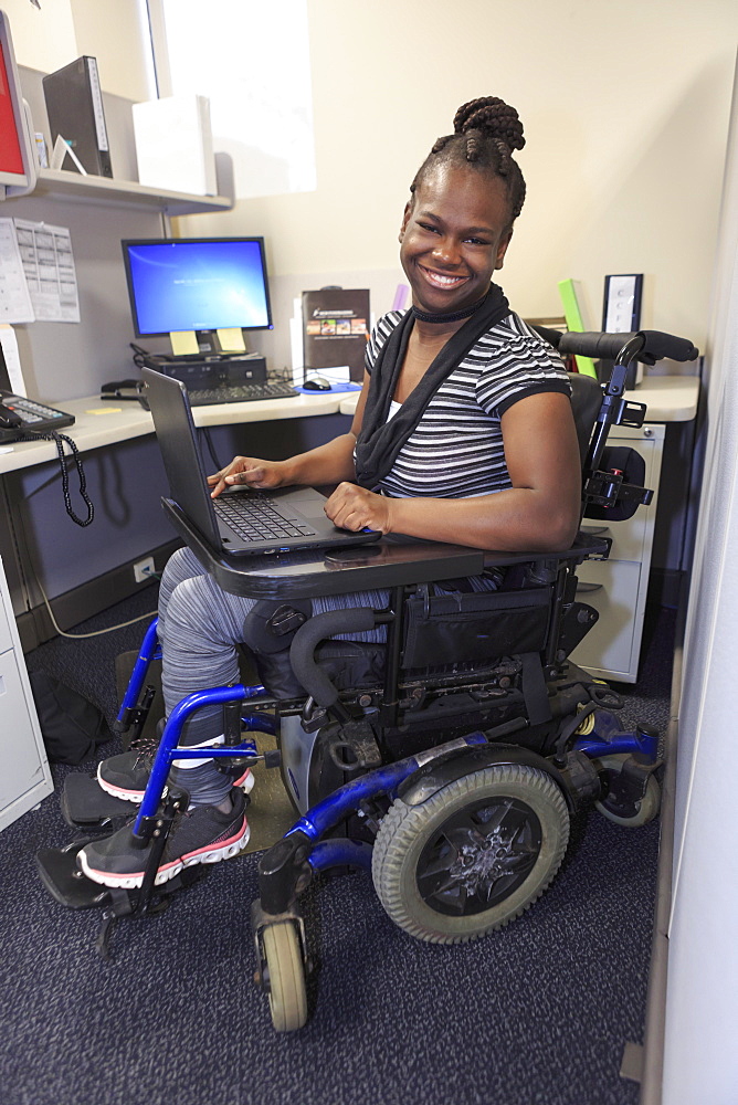 Teen with Cerebral Palsy working in an office