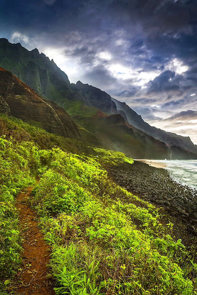 Rugged mountains of Na Pali Coast and Kalalau Beach in morning light, viewed from Kalalau Trail, Na Pali Coast State Park; Kauai, Hawaii, United States of America